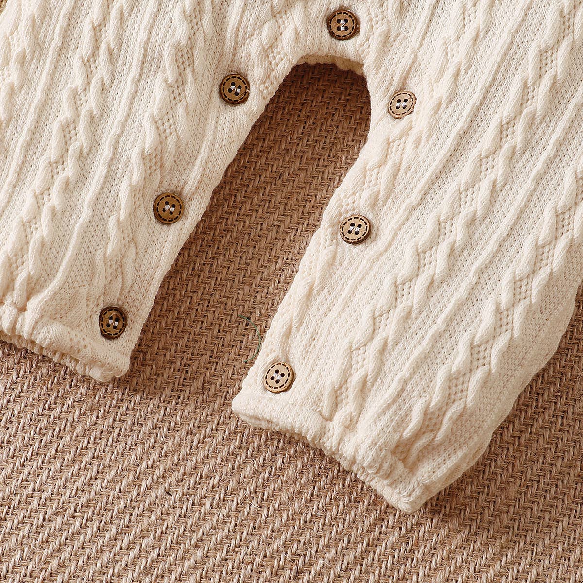 Solid Knitted Button Design Long-sleeve Baby Jumpsuit: 6-9 Months / White