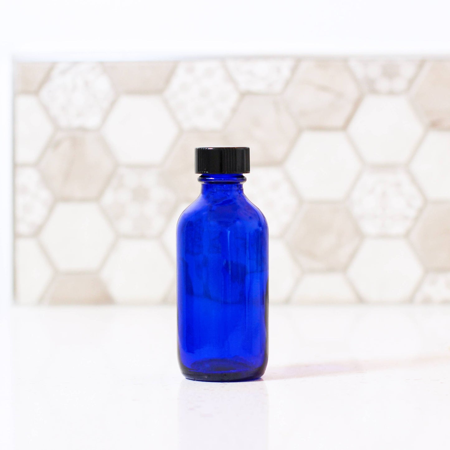2oz Blue Glass Bottle With Cap