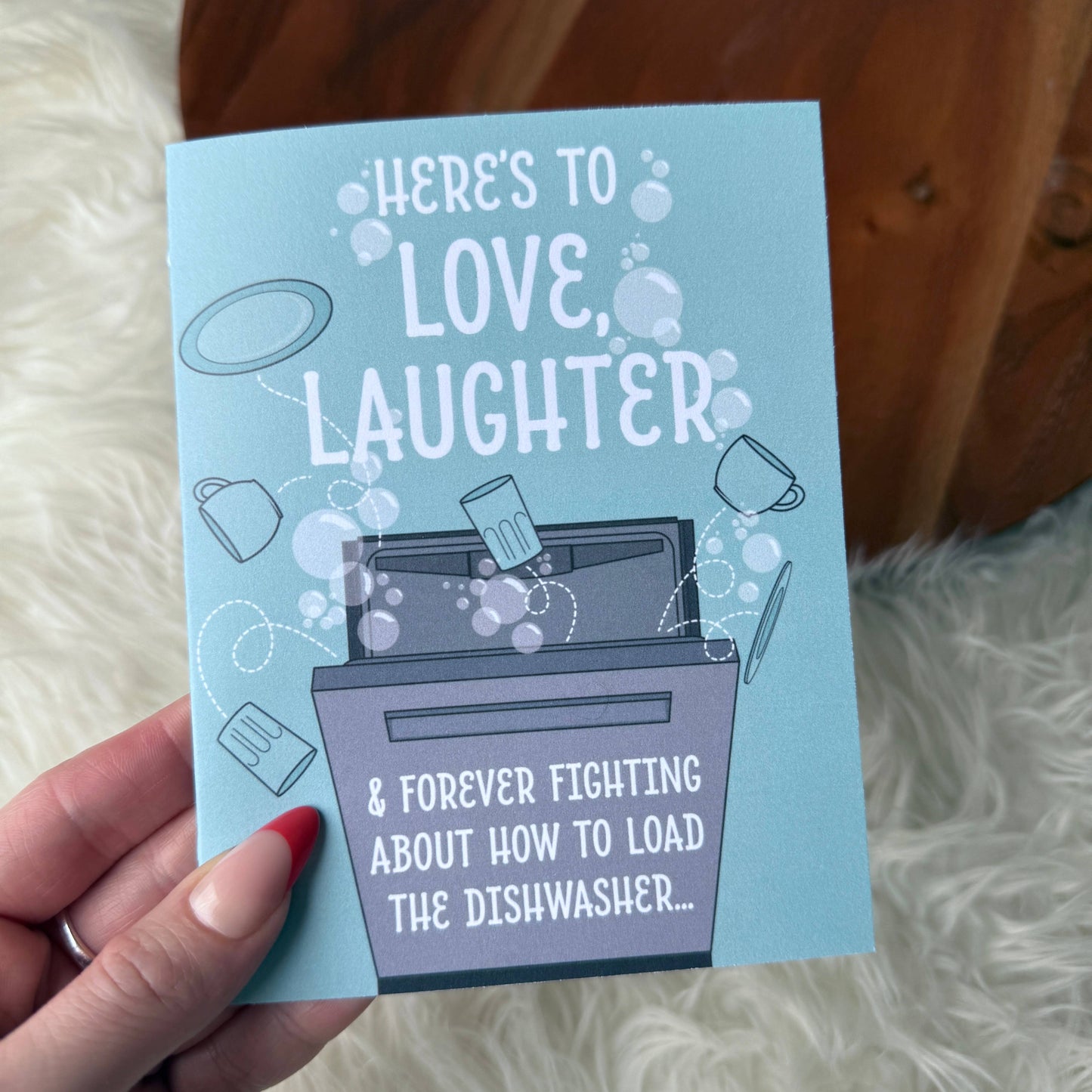 "Here's to love, laughter..." Funny Relatable Wedding Card