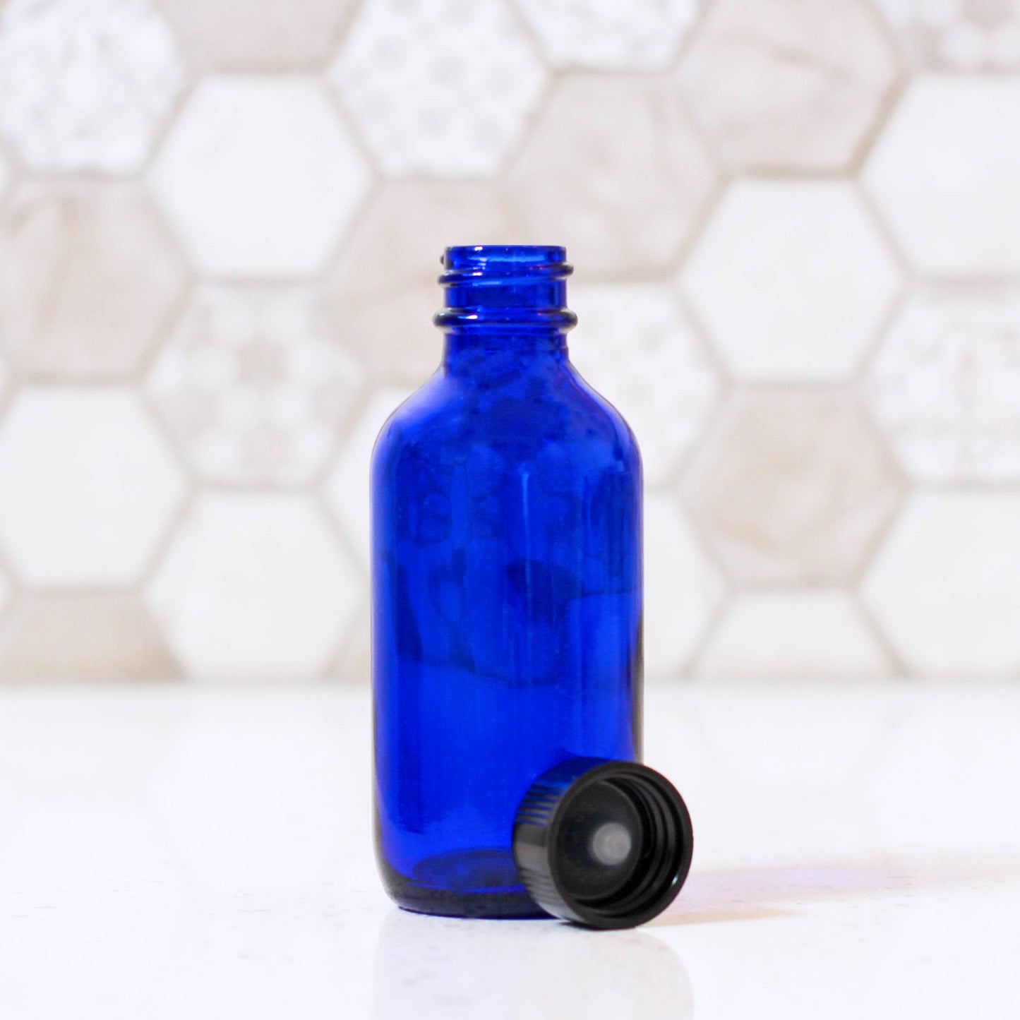 2oz Blue Glass Bottle With Cap